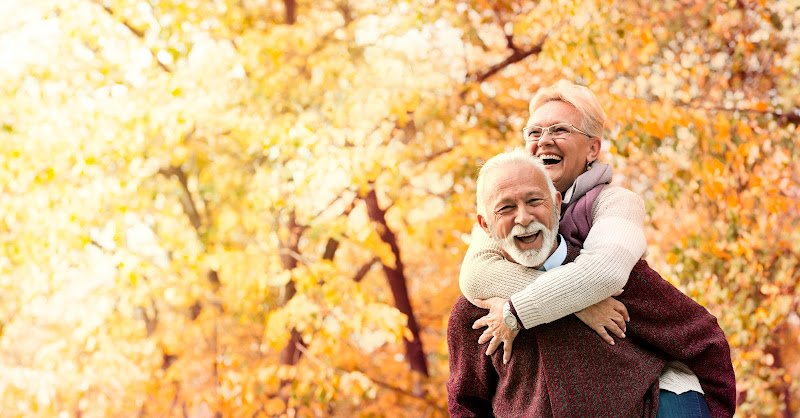 Happy senior couple with healthy white smile